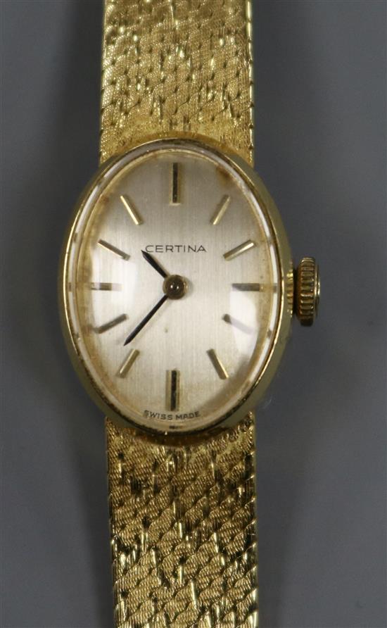 A ladys 18ct gold Certina manual wind wrist watch, on 18ct gold bracelet.